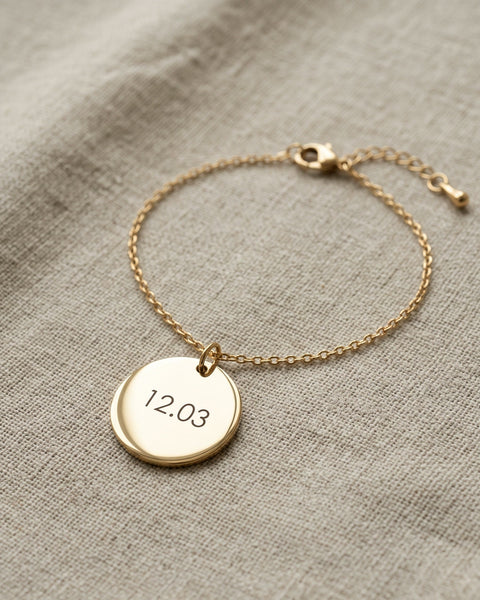 Nº 11, armband met munt 20 mm, goudkleurig roestvrij staal, op linnen ondergrond